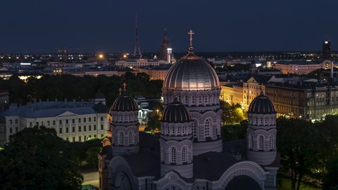 Establishing Aerial View Shot of Riga, Riga super wide skyline, Latvia at night evening