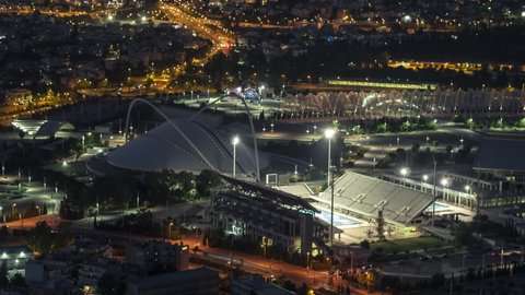 Athens, Greece - circa 2019 - Aerial View Shot of Athens, Olympic Complex, Greece at night evening