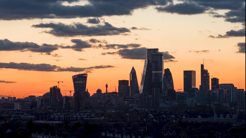Sunset to night time lapse view to the skyline of the financial district City of London, United Kingdom, a Business & Finance Video by Sven Hansche
