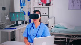 Professional physician wearing virtual reality glasses using medical inovation in hospital. Surgeon working with equipment device, future, medicine, , healthcare, professional, vision, simulator