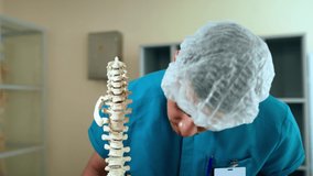In this video, the doctor studies the structure of the spinal column 