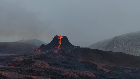 Closing into to an active volcano while snowing