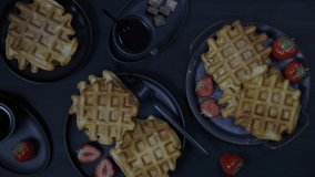 Waffle breakfast with strawberry and coffee.
