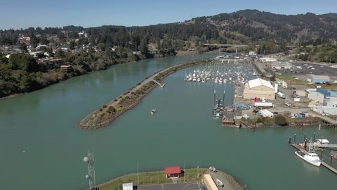 Panorama Of Brookings Port Harbor With Forested Mountains In Background During Summer In Oregon. - Aerial Drone Shot