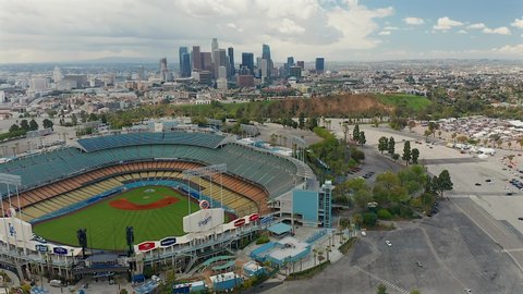 Los Angeles , CA , United States - 03 10 2021: Decending aerial view of Downtown Los Angeles and Dodgers Stadium