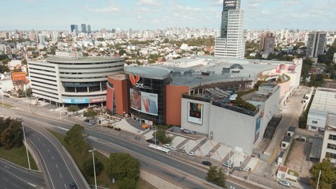 Buenos Aires , Argentina - 02 16 2021: Aerial view of DOT Baires shopping mall revealing General Paz avenue. Dolly out