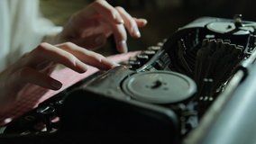 Secretary at old typewriter. Business concepts. Retro style. Pensive. Female hands typing on typewriter looking for inspiration. Close up