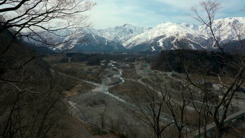 Matsu river  flowing through Hakuba Village and Mt. Shirouma in the distance,hakuba village,Nagano Prefecture,japan