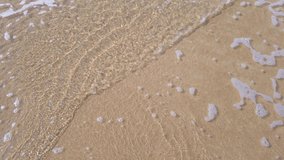 summer video 4k slow-motion of the beach with white sand and wave from sea in sunshine daytime in Phuket, Thailand, peaceful sea