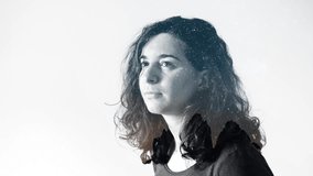 Cinematic double exposure portrait of female face and milky way over mountains. Concept of meditation, philosophy, astronomy and astrology. Stars overlay over girl silhouette. Time-lapse, 4K. - Powered by Shutterstock - Get 15% off with code: PIKWIZARD15