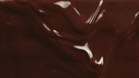 Close-up macro shot hot melted liquid chocolate flows, flowing molten chocolate or dark caramel stream. Cooking handmade chocolate dessert and candies. Confectionery. Pouring chocolate waves - Powered by Shutterstock - Get 15% off with code: PIKWIZARD15