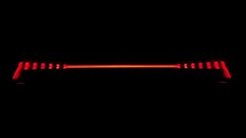 Close up of red headlight turning on, back automotive car optics.  Audi e-tron gt. Black background 4k