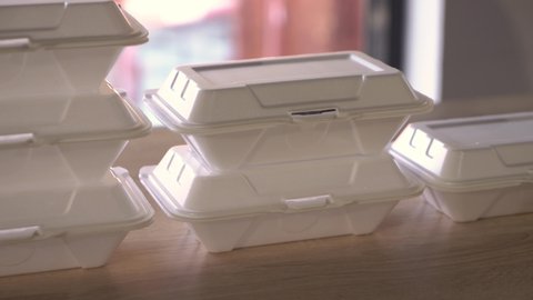  Lunch box containers on the table,  Food delivery service. White foam box stack on table. Delivery boxes arranged side by side on the table. 