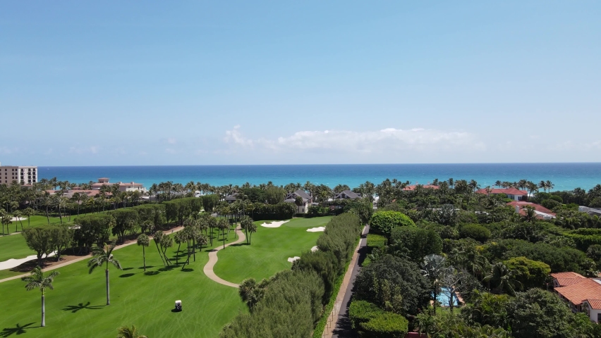 Palm Beach, Florida, panoramic aerial view of the ocean and beautiful well maintained golf course and turquoise blue ocean