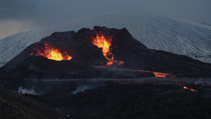 Erupting Volcano And Molten Magma In Geldingadalir, Iceland - wide shot Royalty-Free Stock Footage #1070303059