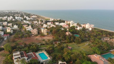 ECR Chennai Near Beach Surrounded By Trees, Construction and Buildings Top View During Sunset.mp4