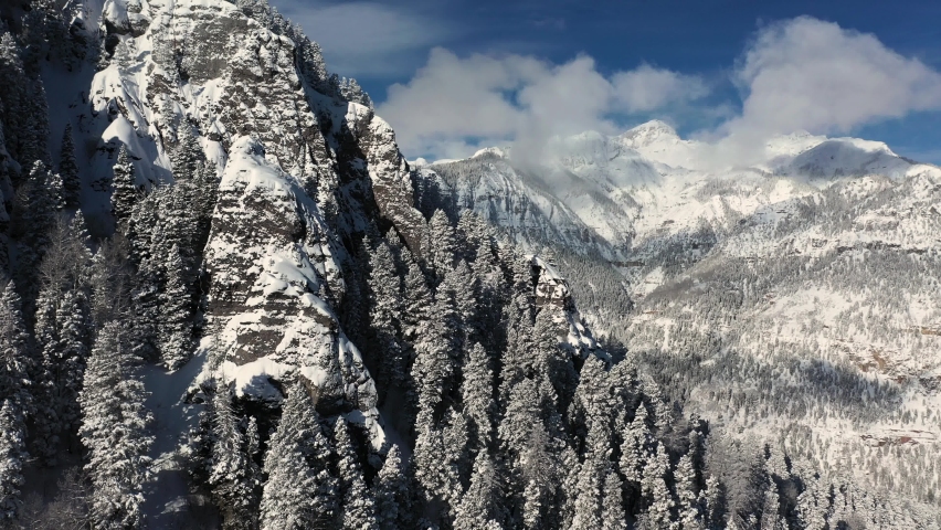 Snowy Mountain Winter Landcape Scenery, Aerial View of Steep Snowcapped Hills on Sunny Day, Drone Shot