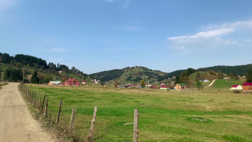 Footage of mountain village (high plateau) called Kadiralak in Tonya district of Trabzon city of Black sea region in Turkey. Beautiful nature scene. Camera moves forward.