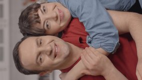 Portrait of happy couple. Holding on to the love of your life.Happy couple who love each other very much while sitting on the sofa hugging her husband behind her.Video for the vertical story. - Powered by Shutterstock - Get 15% off with code: PIKWIZARD15