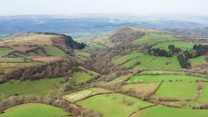 4k aerial view of rural Welsh farmland and countrside on the Wales-England border (Hay Bluff, Wales)