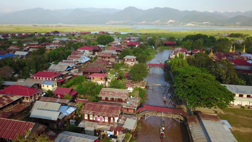 Traditional Floating Fishing Village and Boat Canal, Inle Lake, Myanmar or Burma, Aerial Royalty-Free Stock Footage #1070334673