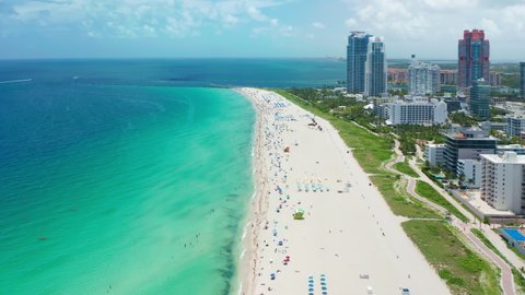 The best beaches in world. Top view waterfront resorts in Miami beach. Hotels on shore of blue sea. Miami, Florida, USA. White sand, beautiful beach, green park. Turquoise sea water, summer vacation