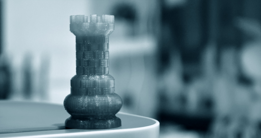 Some abstract isolated object printed on a 3d printer blurred background.