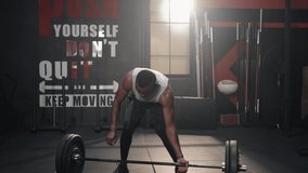 Footage black people workout muscle building exercise in the gym fitness center. Serious black people lifting weights strive to achievement goals.