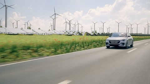 Generic electric car driving through green landscape with solar panels and wind turbines in background. Realistic 3d animation. Generic car and logo design, no intellectual property infringement.