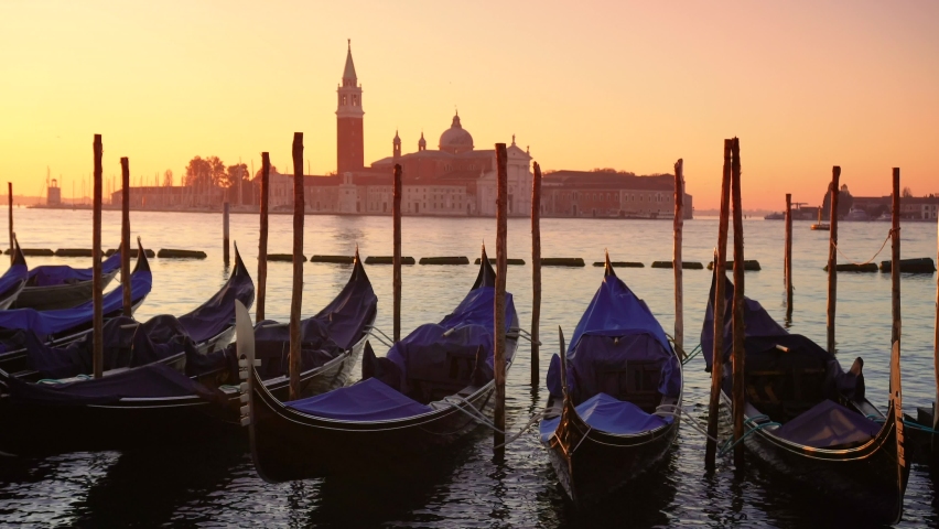Gondolas at sunset with San Giorgio Maggiore in the background Royalty-Free Stock Footage #1070385145