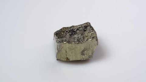 natural pyrite rough gemstone on the background