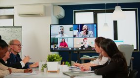 Headshot screen application view of remote multiracial employees talking on video call brainstorm together multiethnic coworkers engaged in team discussion online using web conference, virtual meeting - Powered by Shutterstock - Get 15% off with code: PIKWIZARD15