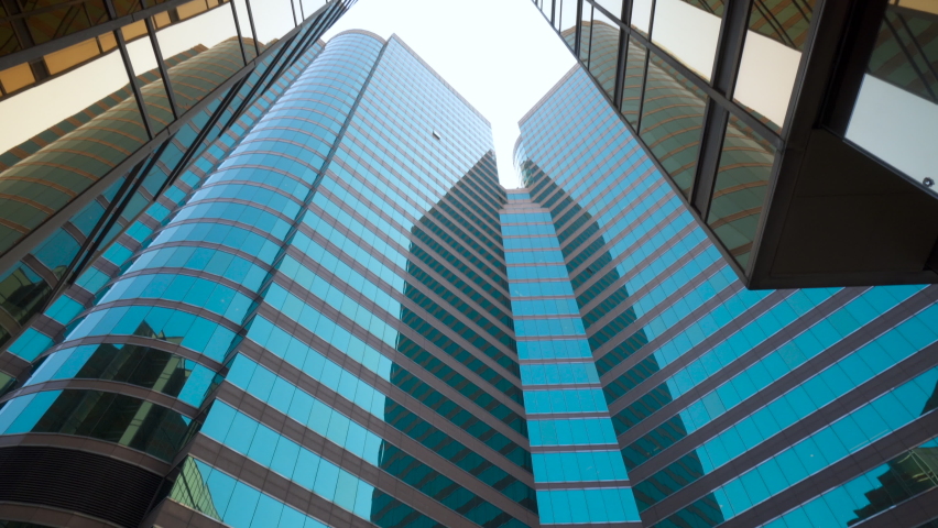 High Rise Buildings with Modern Architecture in Large City Metropolis POV View of Skyscraper Banks Buildings in the Hong Kong City Royalty-Free Stock Footage #1070394427