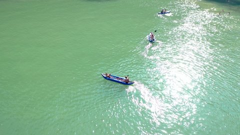 phuket, Thailand 2020 Tourists kayaking in emerald color sea to limestone islands in Phang-nga Bay national park near Phuket Thailand. A famouse activity for summer vacation.