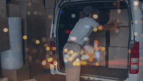 Animation of traffic lights over man loading cardboard boxes into van. global shipping, delivery and online shopping concept digitally generated video.