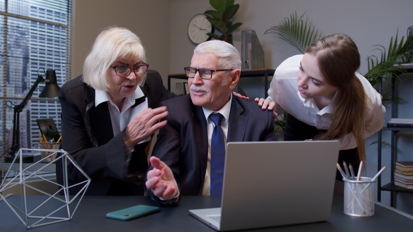 Senior professional businessman grandfather company director having debt problems, financial crisis, bankruptcy. Elderly mature freelancer man crosses fingers for good luck prays but losing in office | Shutterstock HD Video #1070410126