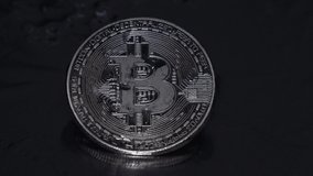bitcoin on a black background in the rain - Powered by Shutterstock - Get 15% off with code: PIKWIZARD15