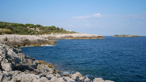 rock outcropping in a beautiful cove on the Tyrrhenian sea on Cilento coast. Marina di Camerota, Salerno, Campania, Italy