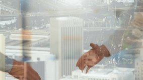 Animation of businessman and businesswoman shaking hands over cityscape. global finances, business and digital interface concept digitally generated video.