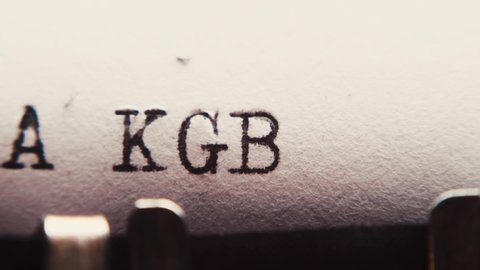 Typing "RUSSIA KGB" on an old typewriter