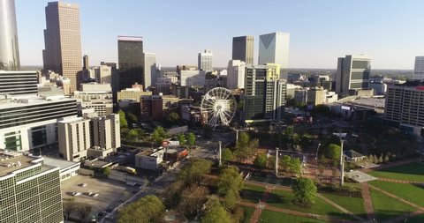 "Atlanta, Georgia USA - 4-2-2021: Aerial parallax shot over Centennial Park in downtown Atlanta"