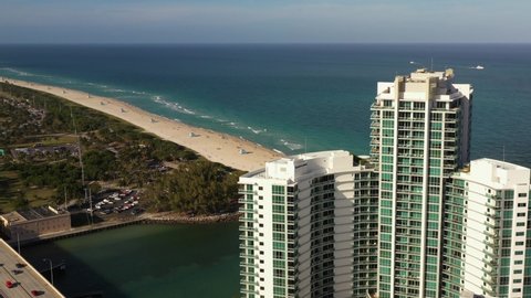 MIAMI BEACH, FL, USA - APRIL 2, 2021: The Ritz Carlton Miami Beach Bal Harbour aerial parallax effect shot