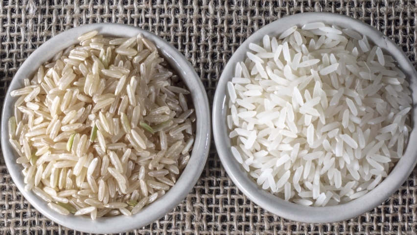 Black venus, red and integral rice pile isolated on jute background in Brazil