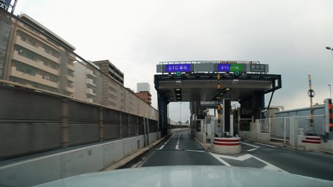 Video of In-vehicle camera. ETC tall gate.  Dashboard camera. Driver point of view. Japanese translation: "Speed down"