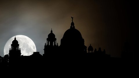 Victoria Memorial by Night;  Time Lapse with Full Moon, Kolkata, West Bengal, India