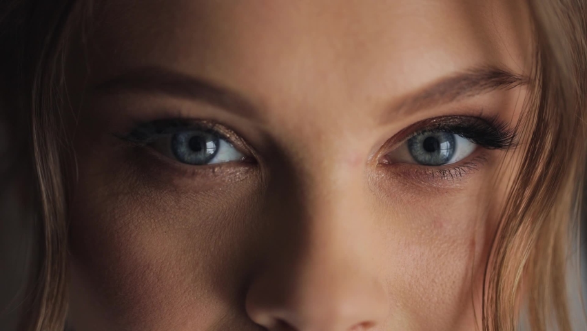 Young beautiful caucasian ukrainian woman opens blue eyes close up macro human iris natural beauty | Shutterstock HD Video #1070459059