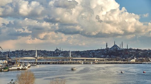 Istanbul panorama time lapse in Halic with beautiful clouds passing above. Suleymaniye Mosque and Halic metro station at background, Istanbul, Turkey. 