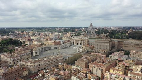 St. Peter's Basilica in Rome and its imposing square. Italy, Vatican.
Aerial shot with drone. Roma, San Pietro, Vaticano. Center city of Roma, Italy.