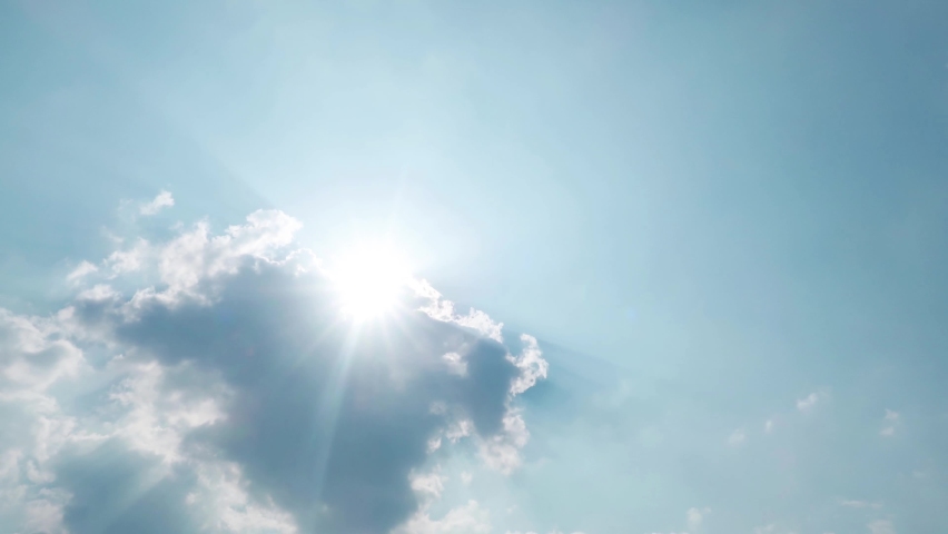 Bright sun light ray flare n sunbeam shining through colorful dark cumulus cloud on Beautiful sunny pastel blue sky in tropical summer sunlight n sunray at daylight sunshine day, 4k b-roll TimeLapse Royalty-Free Stock Footage #1070469916