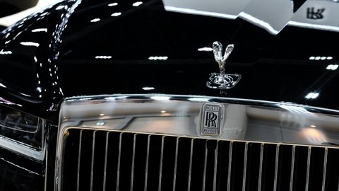 Bangkok, Thailand - April 2, 2021 : New car - Close up high detailed view of Rolls-Royce emblem logo.